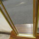 Vertical mirror, gold frame with beading.