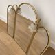 Vintage triptych mirror in brass with wall lights.