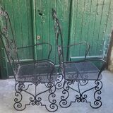 Pair of black wrought iron armchairs