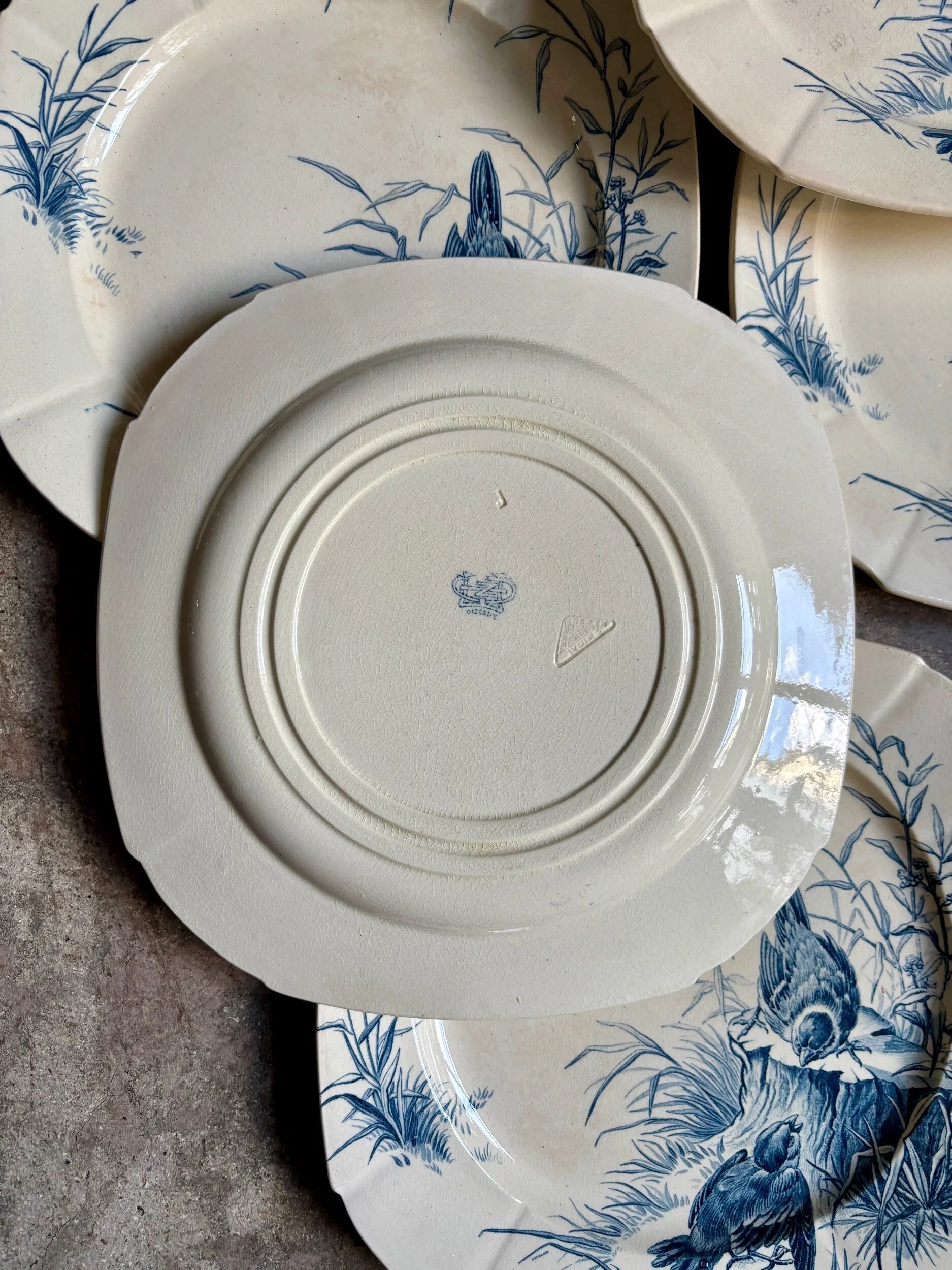 6 blue ironstone flat plates from Gien, "Birds" service, circa 1870, no. 1
