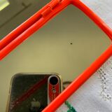 Orange plastic triptych mirror