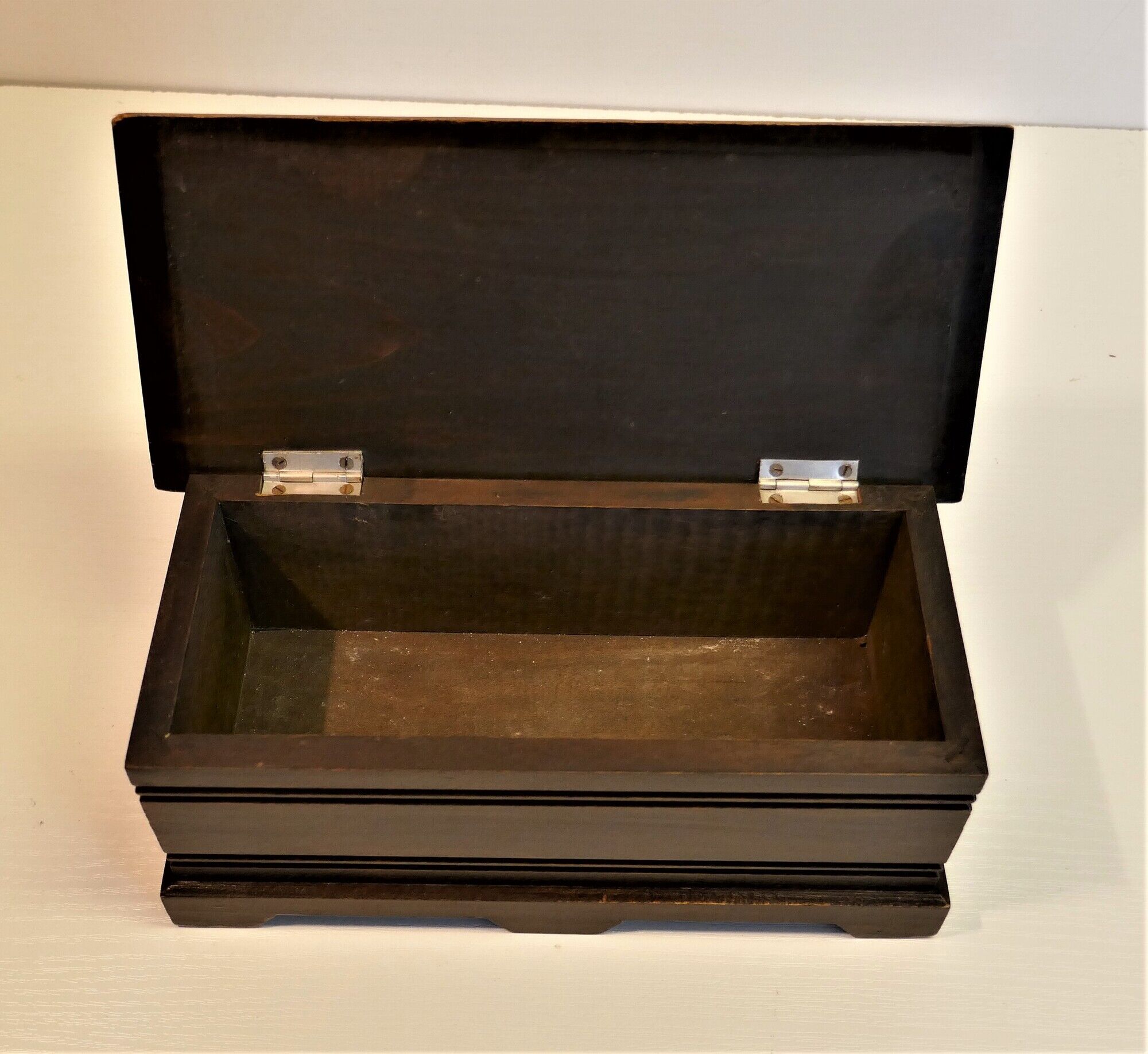Vintage carved wooden box of a mountain landscape in relief
