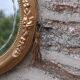 Miroir ovale vintage doré à décor floral et verre biseauté – 58 × 48 cm
