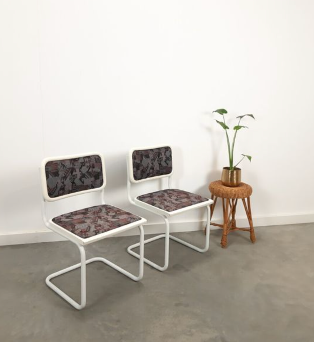 Pair of vintage tubular frame dining chairs