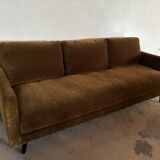 Large velvet three-seater sofa