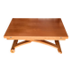 Wooden coffee table convertible into a dining table.
