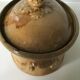 Old terrine of pastry or foie gras in beige glazed earthenware with brown drips. Very beautiful pa