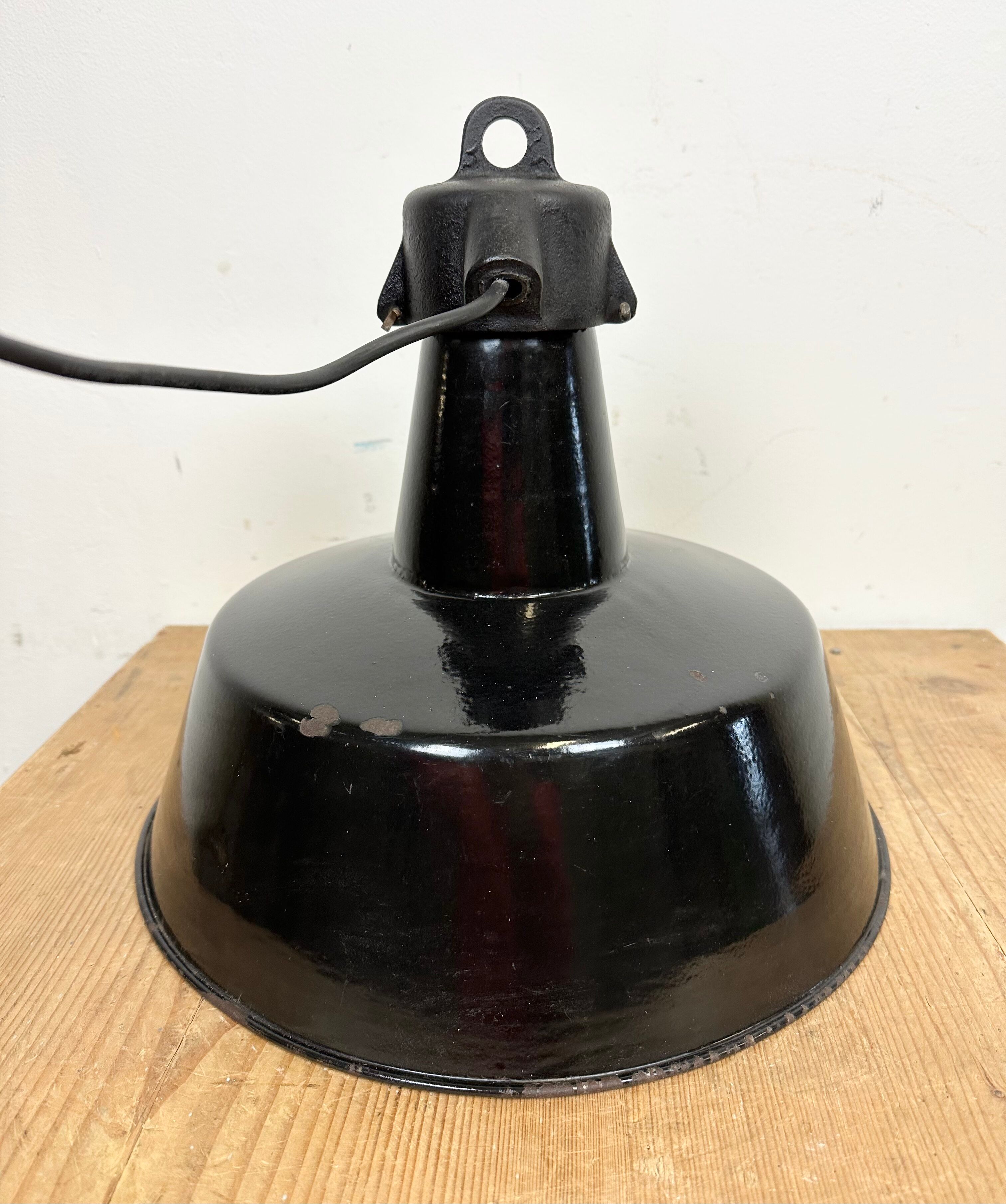 Industrial black enamel factory lamp with cast iron top, 1960s
