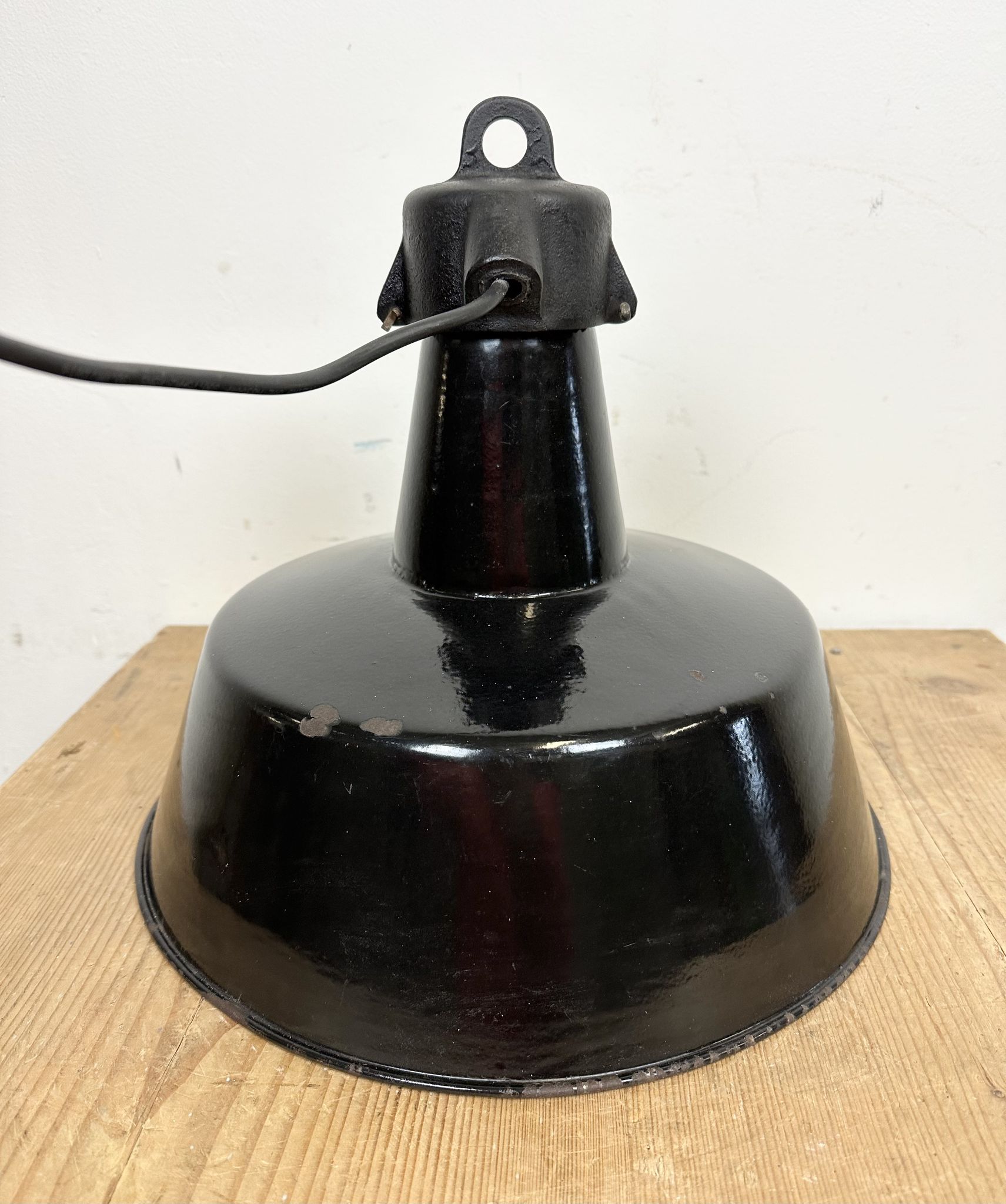 Industrial black enamel factory lamp with cast iron top, 1960s
