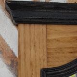 Black mirror and raw natural wood