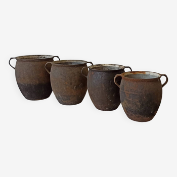 Old cast iron cookware. Flower pots. Set of 4 pieces.