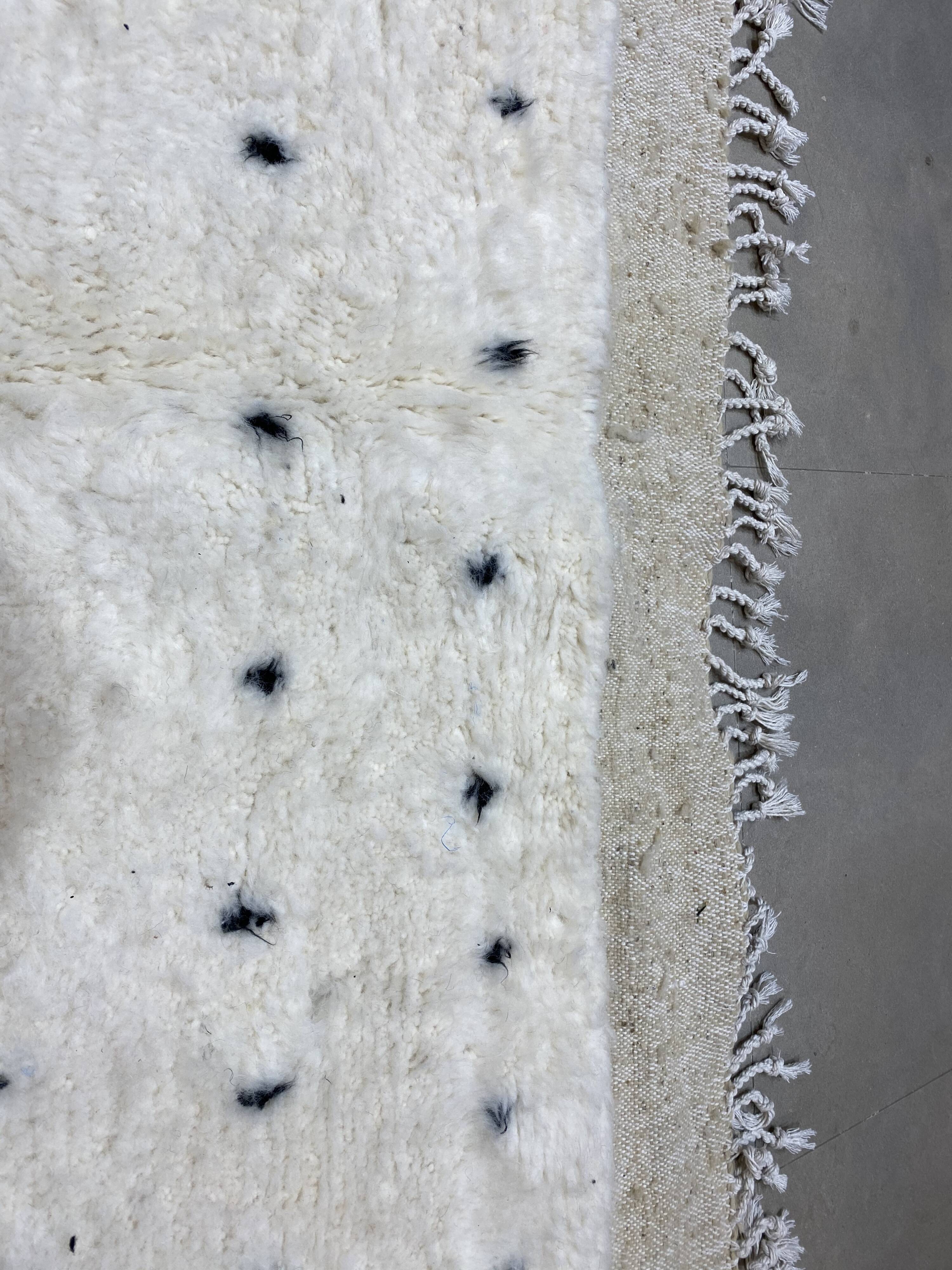 White wool mat with stitches