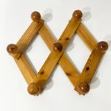 Accordion wall coat rack in solid pine