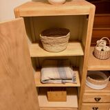 Asymmetrical cabinet made of raw wood