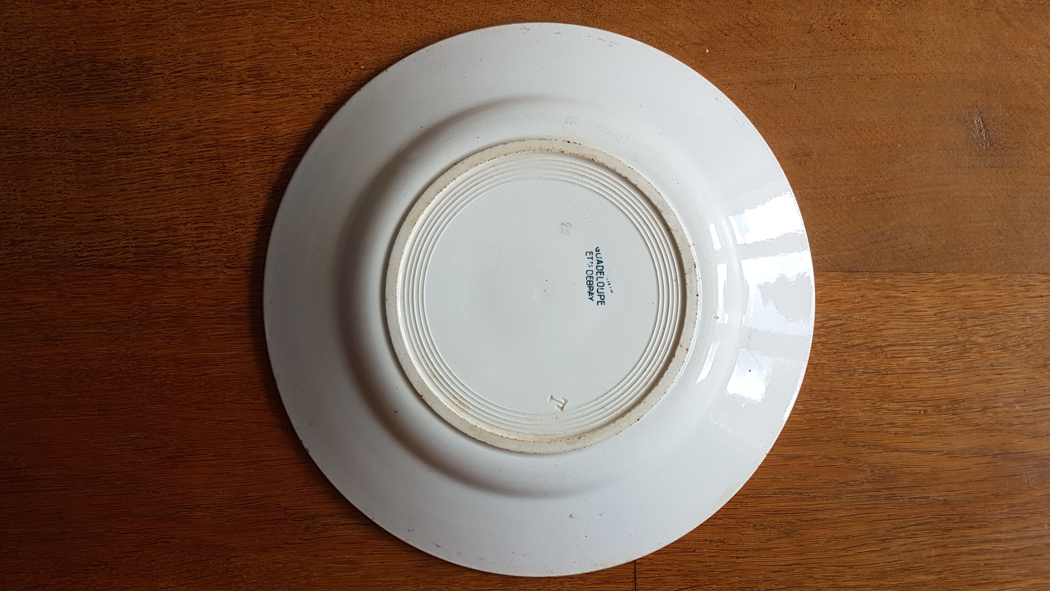 Old plate with wreath decoration