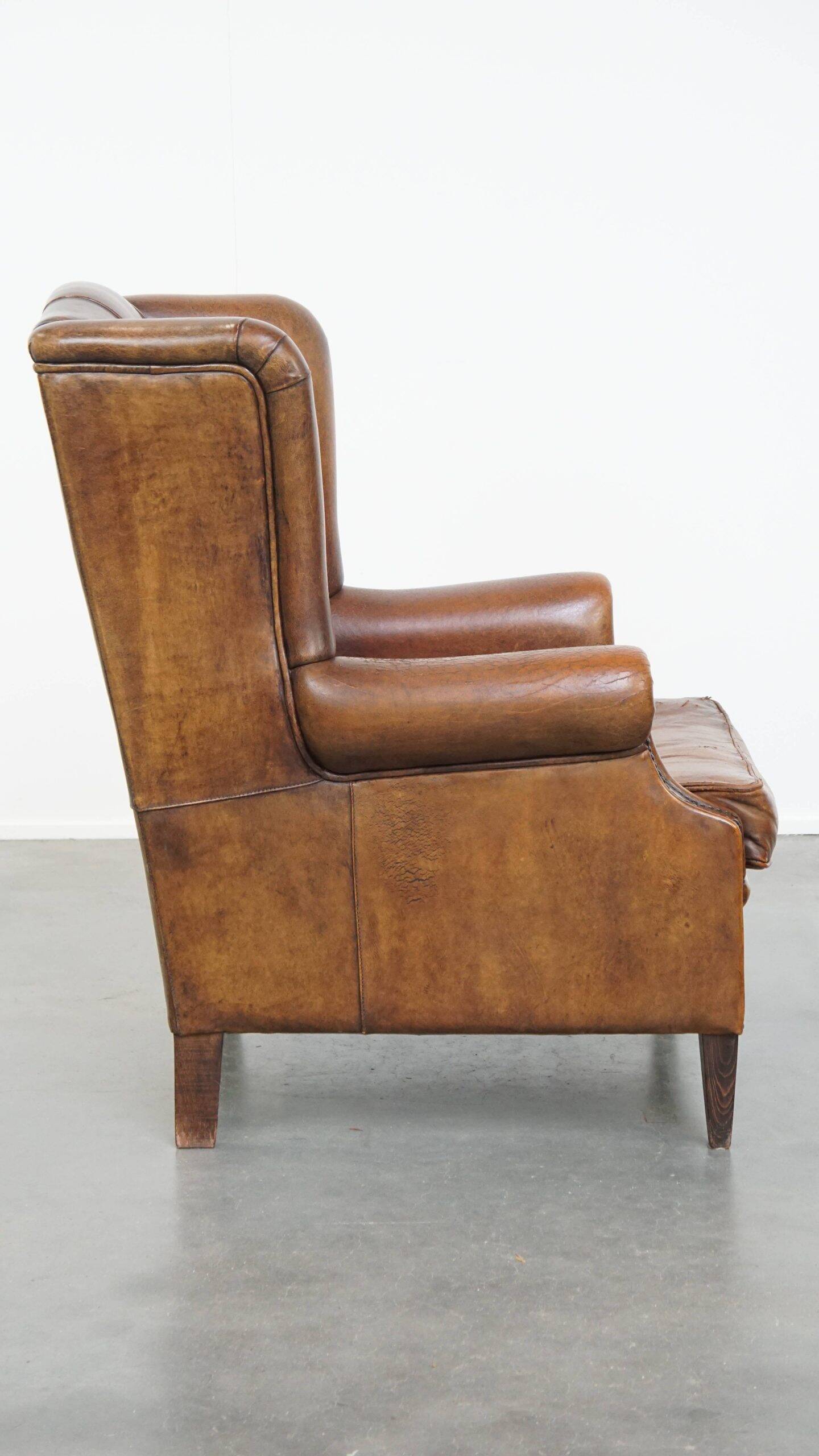 Sheepskin wingback chair in good condition