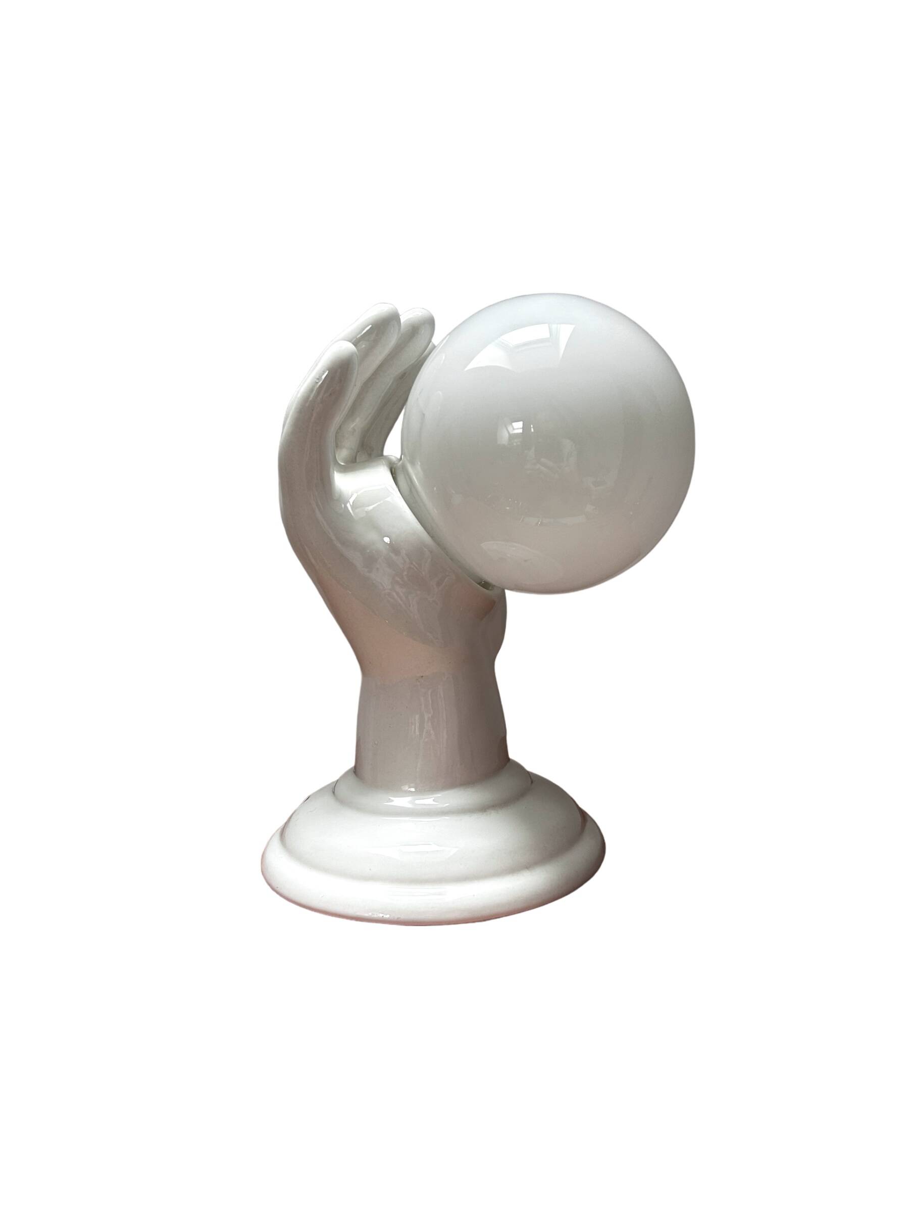 Ceramic hand wall light