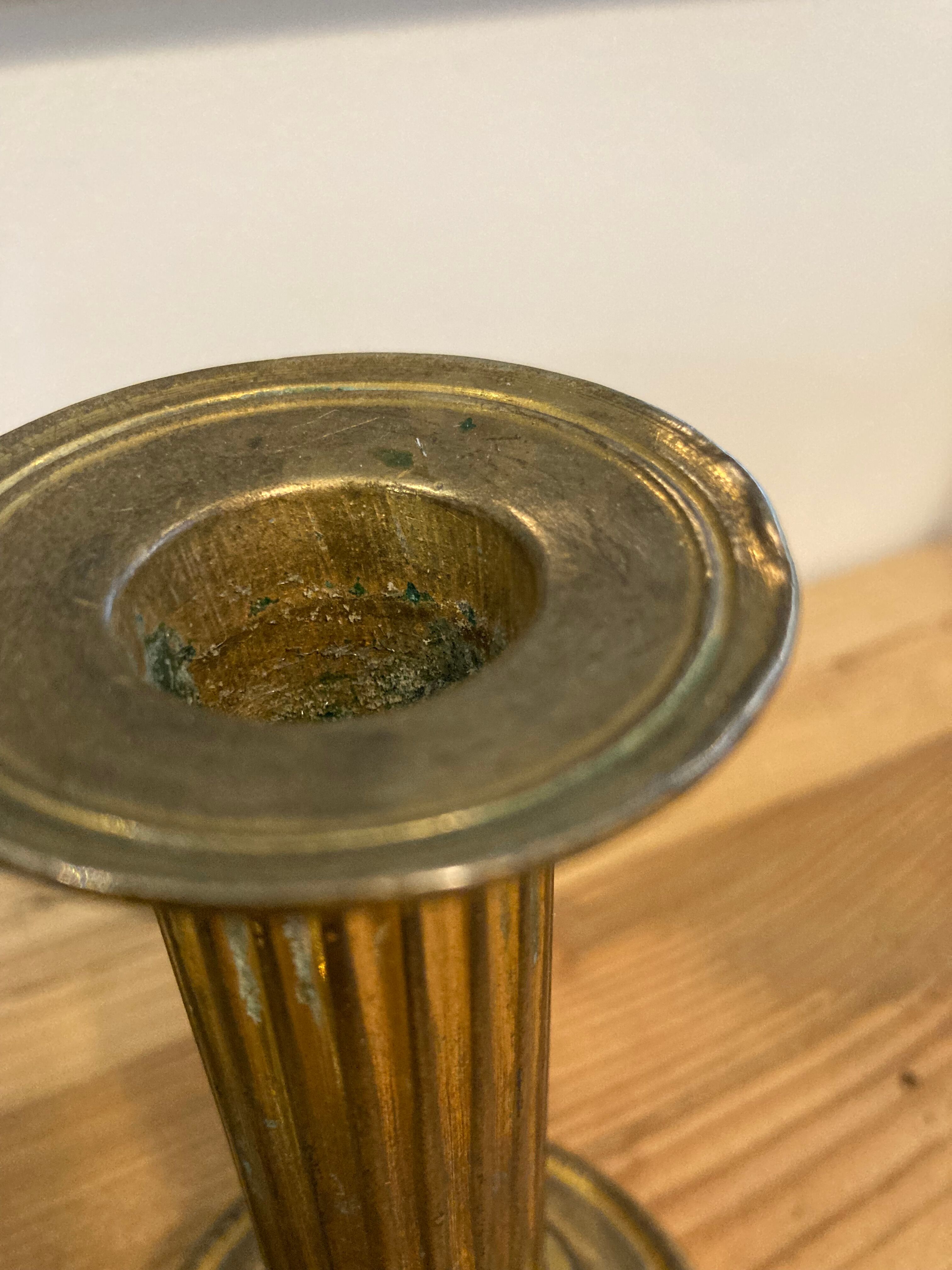 Pair of Louis XVI candlesticks in gilded bronze