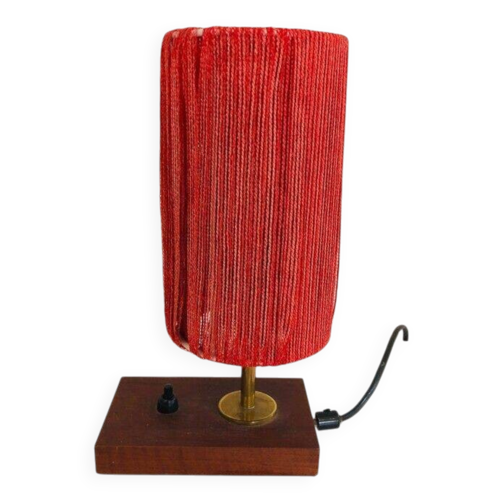 Small lamp made of wood, brass, and wool.