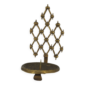 Brutalist bronze wall-mounted candle holder with openwork braces around 1970