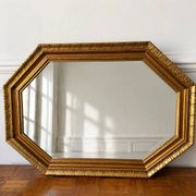 Miroir octogonal doré aux reflets cuivré