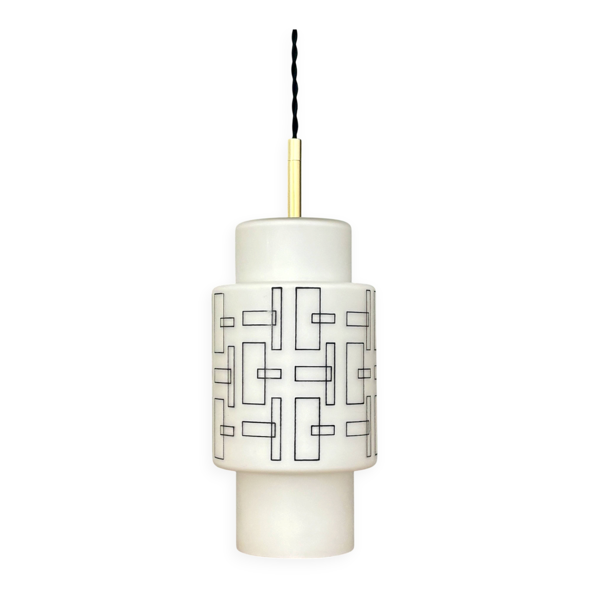 Vintage suspension globe in white opaline with black drawings.