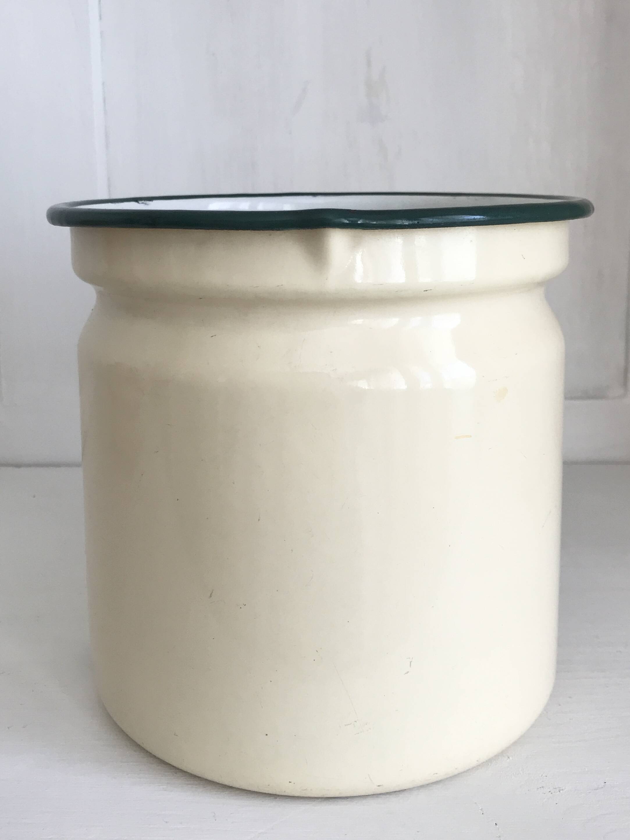 Old milk jug in enameled sheet metal