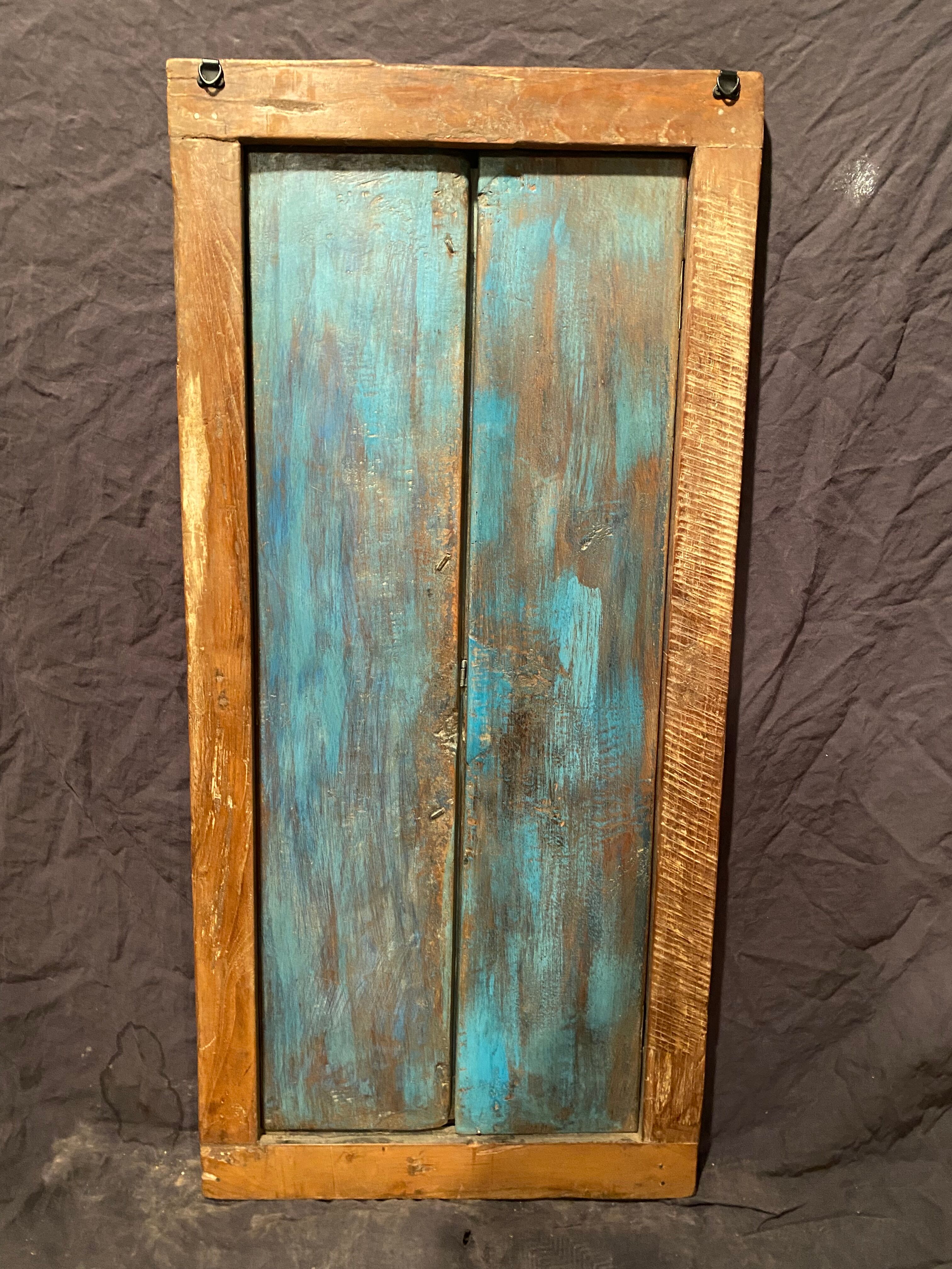 Old Indian window in blue lacquered wood
