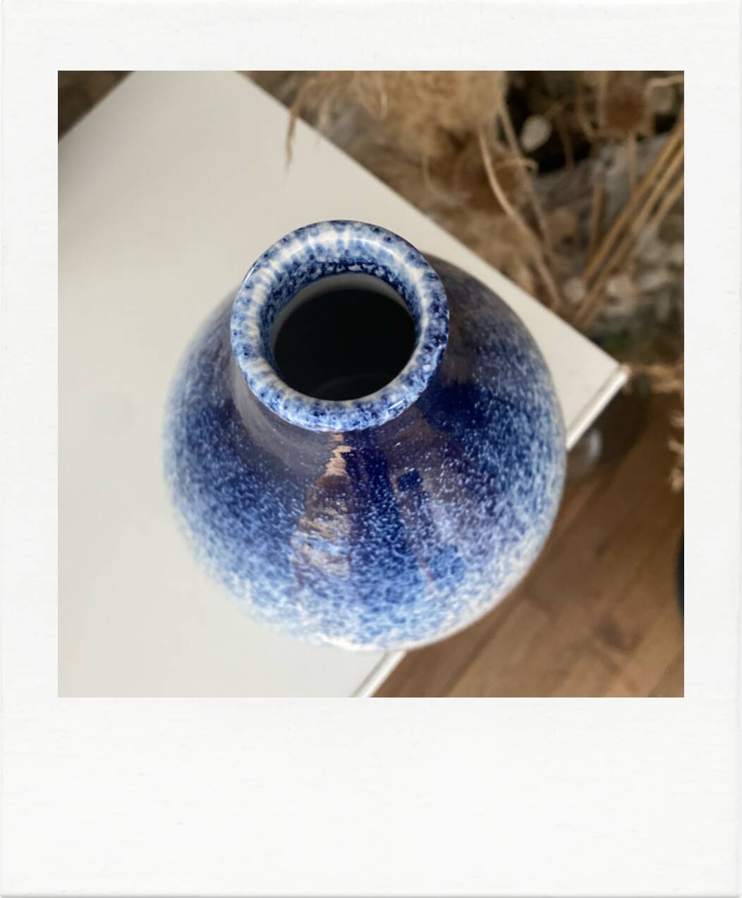 Blue and white speckled vase
