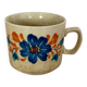 Speckled stoneware cup with blue flower