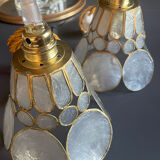 Pair of portable lamps with mother-of-pearl lampshades and brass.