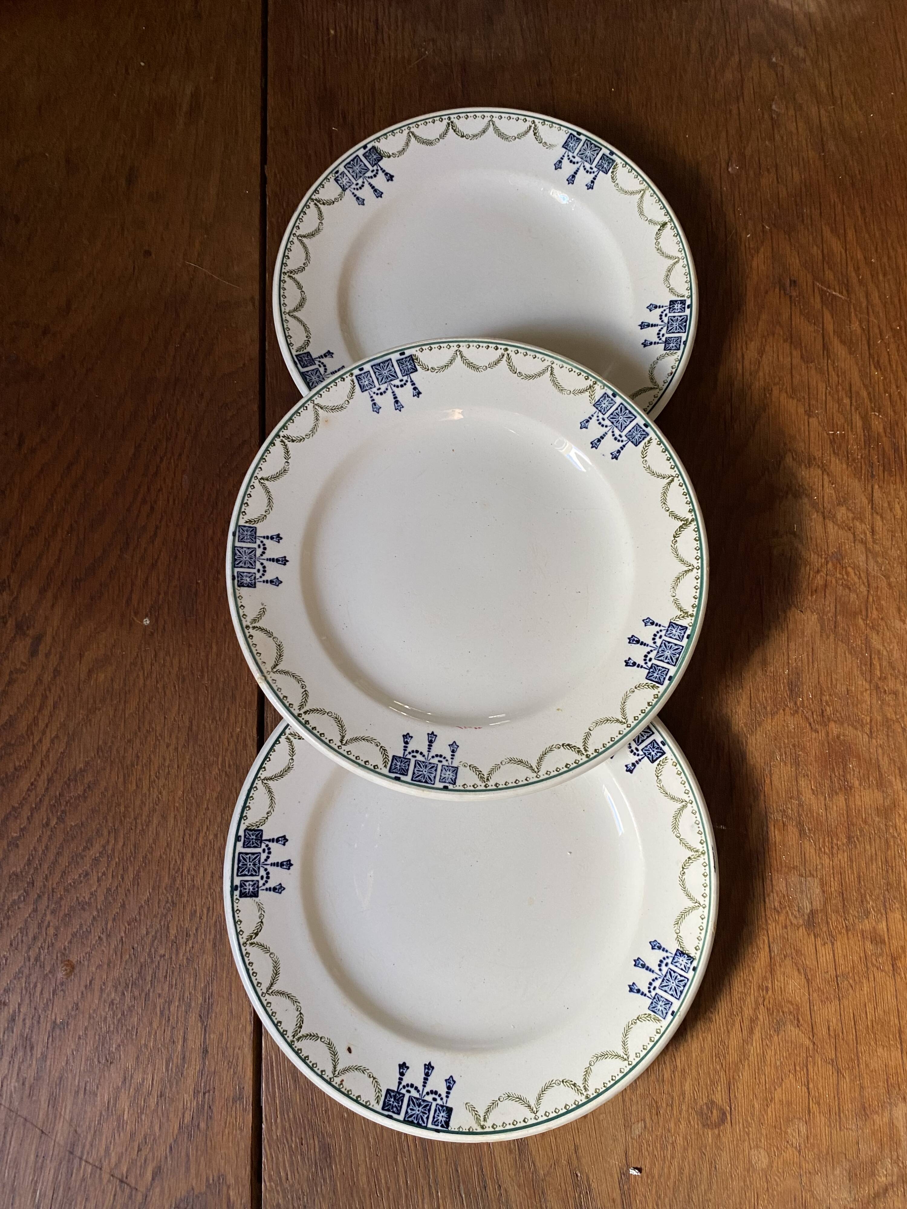 3 dessert plates stamped in art deco style.