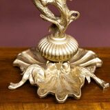 Table lamp with a tall base.