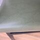 green and metal skai chair