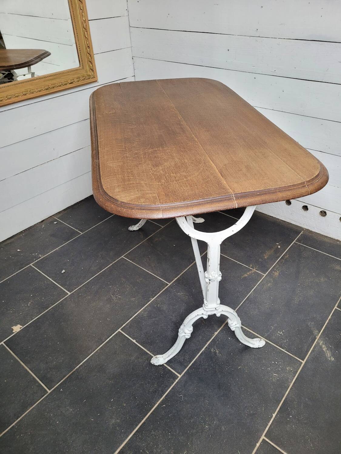 Bistro table with cast iron base and oak top