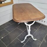 Bistro table with cast iron base and oak top