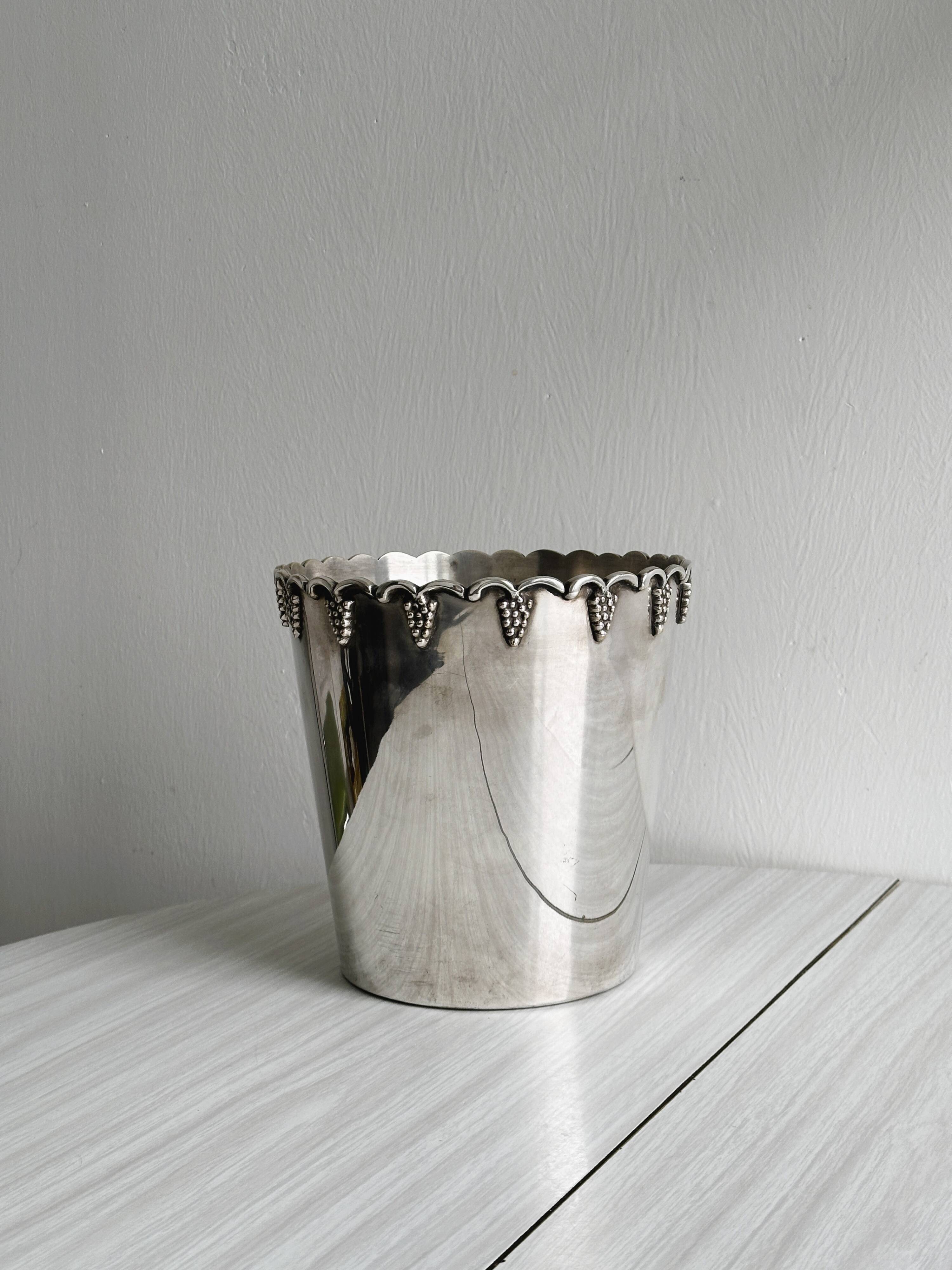 Antique champagne bucket in shiny silver metal