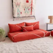 Handmade Moroccan floor cushion in orange cotton.