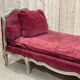 Louis XV style daybed in painted wood and covered with a red velvet