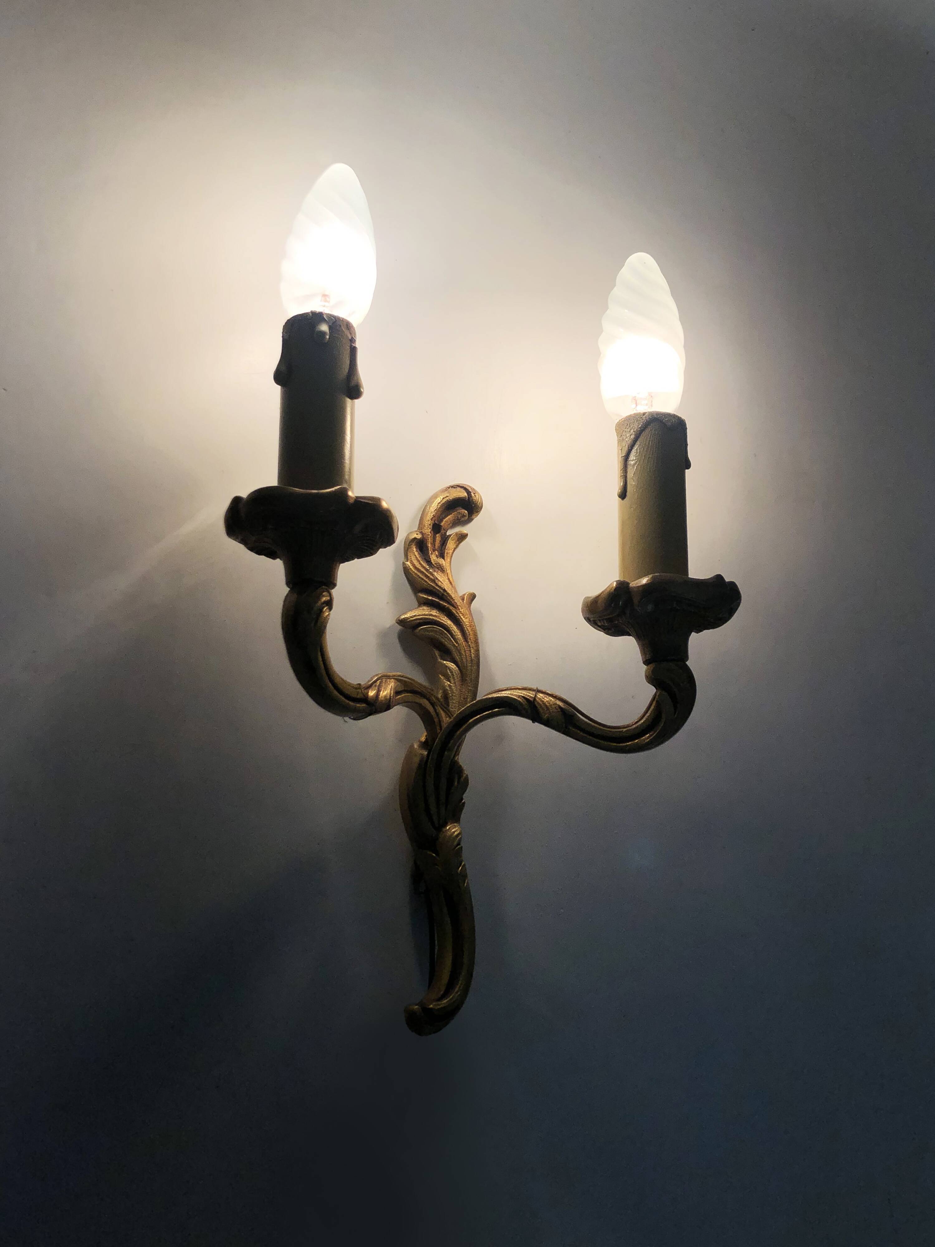 Old pair of double wall sconces in bronze.