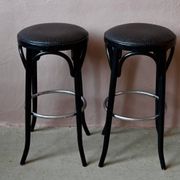 Pair of 1960s bistro bar stools in black and chrome with vinyl shell.