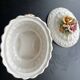 Capodimonte-style porcelain lidded sugar bowl with floral relief