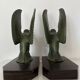 Pair of eagle bookends in green patina regula with rosewood base