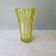 Large Czech vase in pressed glass, tinted yellow with geometric shapes.