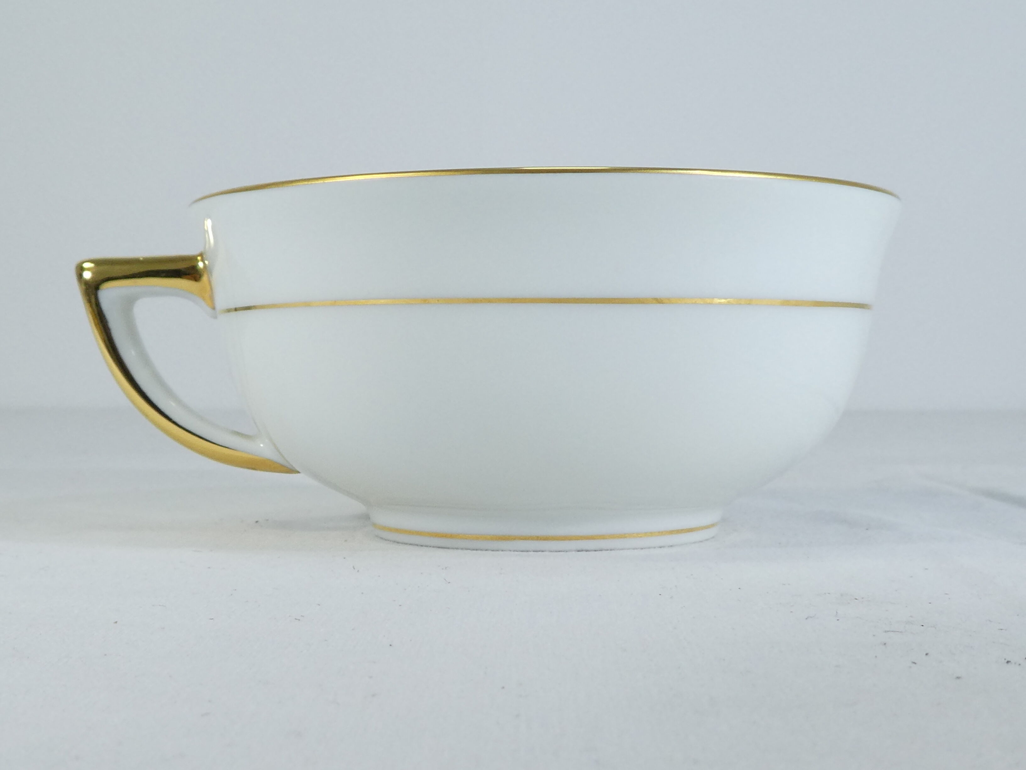 Green and gilded LIMOGES porcelain cup and cup lunch