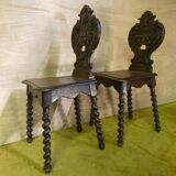 Duo of carved wooden chairs