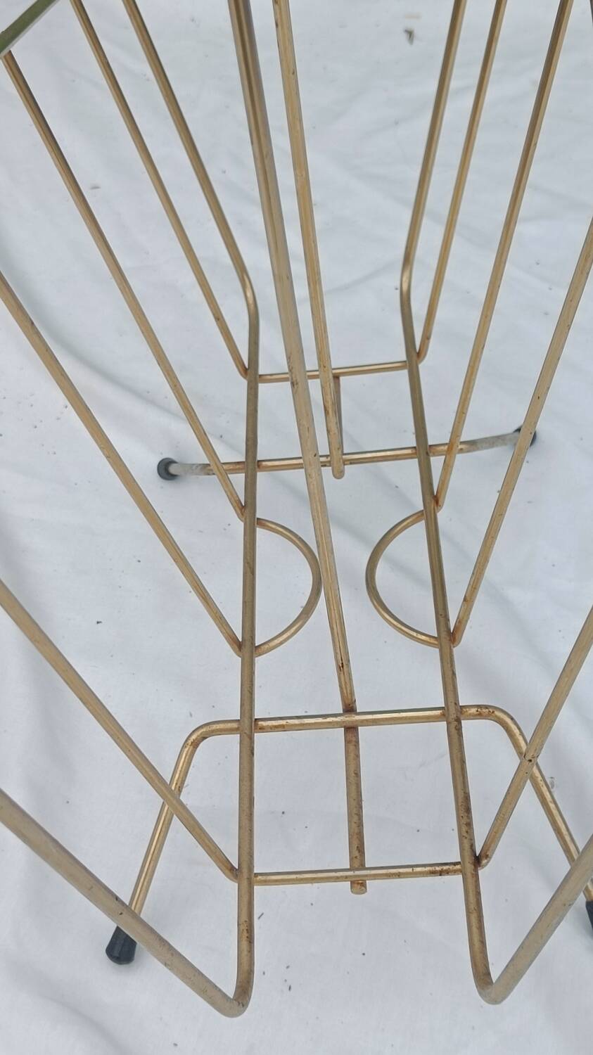 Vintage magazine rack in golden brass