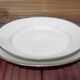 2 round dishes Limoges porcelain blue and gold border