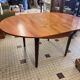 Table ronde en bois avec rallonges intégrées