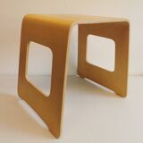 Design stool/side table made of curved plywood.